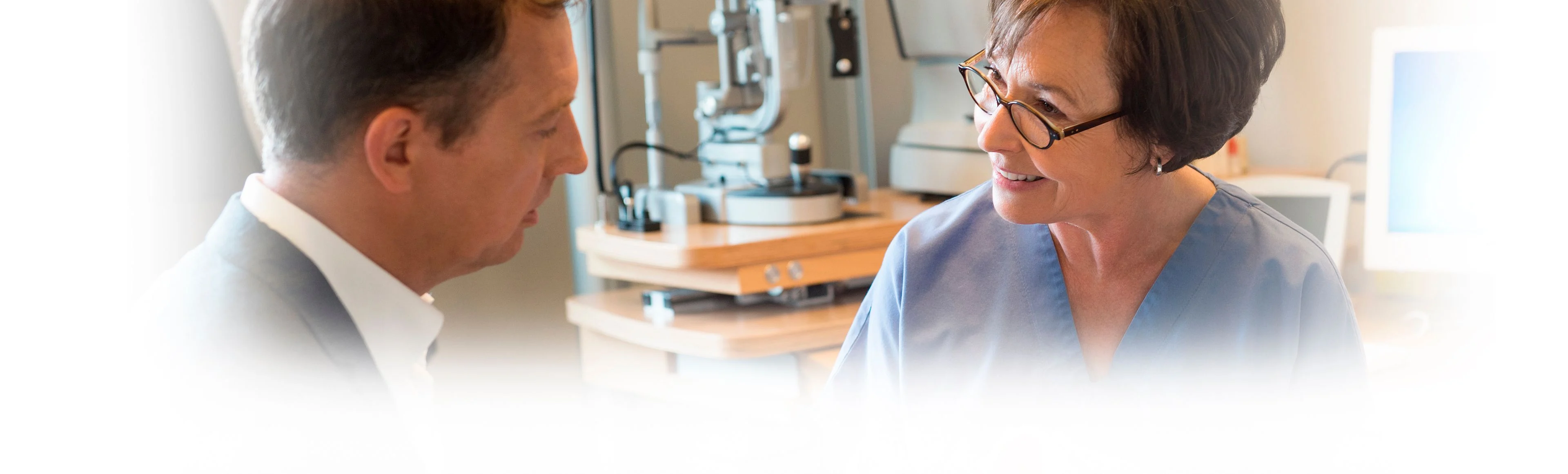A female doctor explains a procedure to a patient